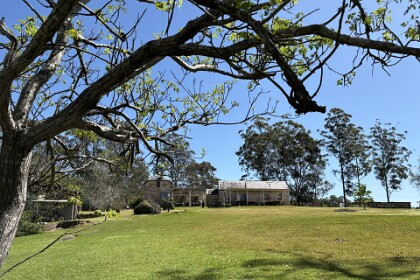 18th September, 2025   Jenni walked down to the Hawkesbury River and took this picture looking back at the vestry and the school master's house on the left.