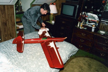 Windy works on his new plane in his bedroom. Of course, where else?