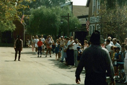 Gunfight at Knott's Berry Farm. It has one ride that I remember liking: Montezuma's Revenge, but it is mostly shops.