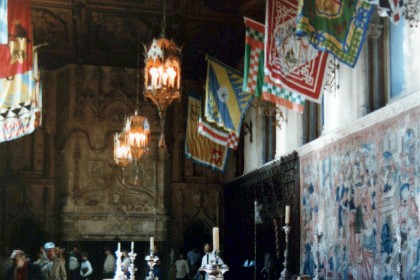 The refectory is the only dining room in the castle, and was built between 1926 and 1927. The choir stalls which line the walls are from the La Seu d'Urgell Cathedral in Catalonia and the silk flags mounted on the walls are Palio banners from Siena. Hearst originally intended a "vaulted Moorish ceiling" for the room but, finding nothing suitable, settled on the Italian Renaissance example (dating from around 1600) which Hearst purchased from a dealer in Rome in 1924.