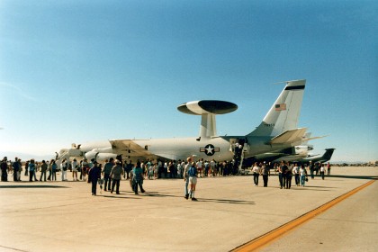 An AWACs Airborne Warning and Control System Boeing E-3. The E-3 is derived from the Boeing 707 airliner and provides all-weather surveillance, command, control, and communications.  It is used by the United States Air Force, NATO, French Air and Space Force, and Royal Saudi Air Force. The E-3 is distinguished by the distinctive rotating radar dome above the fuselage. Production ended in 1992 after 68 aircraft had been built.