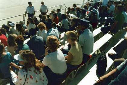 Keith and Barbara Trostle sit with Jenni in the VIP stand.