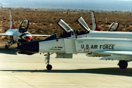 F4 Phantom taxis past the waiting Thunderbird F16s to begin its display.