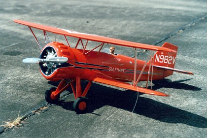 This is nice.  It's a model of a real plane, a Curtis 1A "Gulfhawk".  This is a civilian version of 1930s fighter; orange with black and white trim. Pratt & Whitney Wasp R-1340, 600 hp engine , the original is currently on display at the Smithsonian Air and Space Museum.