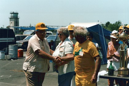 George Aldrich congratulates Art, Betty Adamisin is by Art's side.