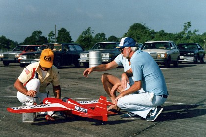 Bob pumps fuel into his plane and gets ready to fly.