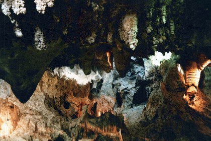 Carlsbad Caverns National Park is an American national park in the Guadalupe Mountains of southeastern New Mexico. The primary attraction of the park is the show cave, Carlsbad Cavern. Visitors to the cave can hike in on their own via the natural entrance or take an elevator from the visitor center.