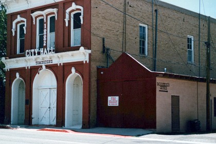 Tombstone is a town in southeastern Arizona, known for its Wild West history. Exhibits at the Tombstone Courthouse State Historic Park include a replica gallows. On historic Allen Street, the O.K. Corral outdoor theater re-enacts an 1881 cowboy gunfight. Resident ghosts are said to haunt the bullet-riddled Bird Cage Theatre. Outlaws are among the local townsfolk buried at the 1878 Boothill Cemetery.