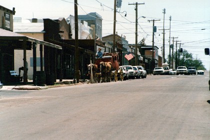 What's interesting here is a bitumen-sealed main street and electricity poles with transformers. When we come through here a few years later, all of the electrical equipment is buried underground and the main street has reverted to dirt.  It looks much better and more realistic now.