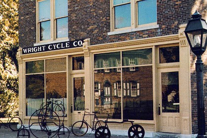 Wright Bros. Store.  The Wright Cycle Shop has been called the "Birthplace of Aviation" because it was here that the Wrights' conducted many experiments and constructed the world's first successful heavier-than-air manned aircraft.  The cycle shop originally located a few blocks from the Wright home in Dayton, Ohio was the last of four establishments where the brothers engaged in the cycle business.  It is restored to look as it did in 1903, the year of the Wrights' first flight.