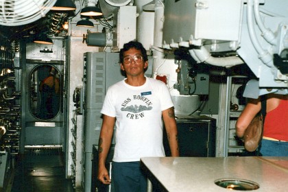 A volunteer on board. We did not realise how extremely cramped the sleeping quarters are.  There were tiny sleeping quarters for the officers and the listed quarters slept in bunks above the torpedoes.