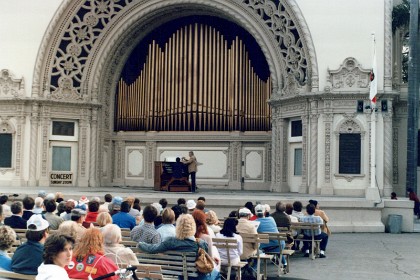 In Balboa Park, an organist is playing Bach's Toccata and Fugue in D Minor.  Dean is unimpressed.