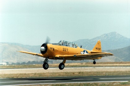 The North American Aviation T-6 Texan is an American single-engined advanced trainer aircraft used to train pilots of the United States Army Air Forces, United States Navy, Royal Air Force, Royal Canadian Air Force and other air forces of the British Commonwealth during World War II and into the 1970s. Top speed: 335 km/h Engine type: Pratt & Whitney R-1340 Wasp First flight: 1 April 1935 Variants: North American A-27; Bacon Super T-6 Manufacturer: North American Aviation Number built: 15,495 Role: Trainer aircraft