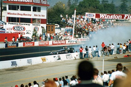 A burnout gets the tyres hot and puts sticky rubber on the track.