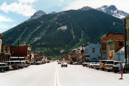 This is Silverton CO which was established shortly after the Utes ceded the region in the 1873 Brunot Agreement. The town boomed from silver mining until the Panic of 1893 led to a collapse of the silver market, and boomed again from gold mining until the recession caused by the Panic of 1907.