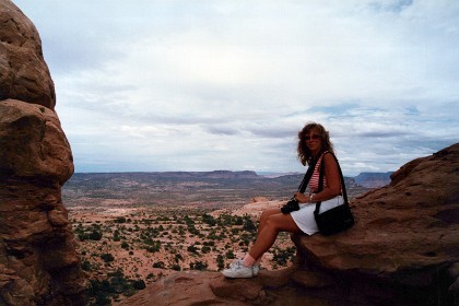 If you stood in Devils Garden then, the striking red rock features we see today would have been buried thousands of feet below you, raw material as yet uncarved. Jenni sitting in the North Window.