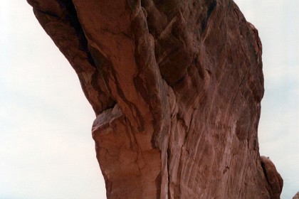 Tourists seem like dwarfs compared with the size of the arch.  Wall Arch, located along the popular Devils Garden Trail at Arches National Park collapsed sometime during the night of August 4, 2008. Rock has continued to fall from the arms of the remaining portion of the arch necessitating the closure of the Devils Garden Trail just beyond Landscape Arch. I don't have a picture of the wall arch.