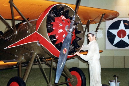 Boeing P-12E. Developed by the Boeing Aircraft Co. at its own expense, the P-12 was became one of the most successful American fighters produced between the World Wars. Flown by both the Army and the Navy (as the F4B), the P-12 series consisted of an initial version and five additional models, B through F. The early versions used fabric-covered fuselages of bolted aluminum tubing, but the P-12E and F fuselages employed an all-metal, semimonocoque (stressed skin) construction. However, the P-12 did not complete the evolution into an all-metal aircraft because all variants had wooden wings with fabric covering. TECHNICAL NOTES: Armament: Two .30-cal. or one .30-cal. and one .50-cal. machine guns; 244 lbs. of bombs carried externally Engine: Pratt & Whitney R-1340-17 of 500 hp Maximum speed: 189 mph Cruising speed: 160 mph Range: 570 miles Ceiling: 26,300 ft. Span: 30 ft. Length: 20 ft. 4 in. Height: 9 ft. Weight: 2,690 lbs. loaded Serial number: 31-559