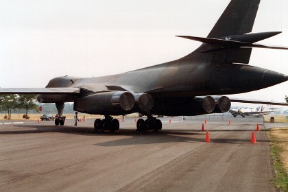 B1 Bomber. Boeing B-1B Lancer The Boeing (formerly Rockwell International) B-1B Lancer is the improved variant of the B-1A, which was cancelled in 1977. Initiated in 1981, the first production model of this long-range, multi-role, heavy bomber flew in October 1984. The first operational B-1B was delivered to Dyess Air Force Base, Texas, in June 1985, and the final B-1B was delivered in 1988. TECHNICAL NOTES: Crew: Four (aircraft commander, copilot, offensive systems officer, defensive systems officer) Engines: Four General Electric F-101-GE-102 turbofan engines of 30,000+ lbs. thrust each, with afterburner Wingspan: 137 ft. extended forward, 79 ft. swept aft Length: 146 ft. Height: 34 ft.