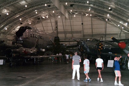 Douglas B18 to the right of the C124. The Douglas Aircraft Co. developed the B-18 to replace the Martin B-10 as the U.S. Army Air Corps' standard bomber. Based on the Douglas DC-2 commercial transport, the prototype B-18 competed with the Martin 146 (an improved B-10) and the four engine Boeing 299, forerunner of the B-17, at the Air Corps bombing trials at Wright Field in 1935. Although many Air Corps officers judged the Boeing design superior, the Army General Staff preferred the less costly Bolo (along with 13 operational test YB-17s). The Air Corps later ordered 217 more as B-18As with the bombardier's position extended forward over the nose gunner's station.  TECHNICAL NOTES: Armament: Three .30-cal. guns (in nose, ventral and dorsal positions), plus 4,500 lbs. of bombs carried internally Engines: Two Wright R-1820-53s of 1,000 hp each Crew: Six Maximum speed: 215 mph at 15,000 ft. Cruising speed: 167 mph Range: 2,100 miles Ceiling: 23,900 ft. Span: 89 ft. 6 in. Length: 57 ft. 10 in. Height: 15 ft. 2 in. Weight: 27,000 lbs. loaded Serial number: 37-0469