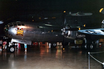 Boeing B-29 Superfortress. The B-29 on display, Bockscar, dropped the Fat Man atomic bomb on Nagasaki on Aug. 9, 1945, three days after the atomic attack against Hiroshima. Bockscar was one of 15 specially modified "Silverplate" B-29s assigned to the 509th Composite Group. Most B-29s carried eight .50-cal. machine guns in remote controlled turrets, two .50-cal. machine guns and one 20mm cannon in a tail turret, and up to 20,000 pounds of bombs. Silverplate B-29s, however, retained only the tail turret and had their armor removed to save weight so that the heavy atomic bombs of the time could be carried over a longer distance. TECHNICAL NOTES: Armament: Eight .50-cal. machine guns in remote controlled turrets plus two .50-cal. machine guns and one 20mm cannon in tail; 20,000 lbs. of bombs Engines: Four Wright R-3350s of 2,200 hp each Maximum speed: 357 mph Cruising speed: 220 mph Range: 3,700 miles Ceiling: 33,600 ft. Span: 141 ft. 3 in. Length: 99 ft. Height: 27 ft. 9 in. Weight: 133,500 lbs. maximum Serial number: 44-27297