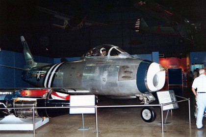 North American F-86A Sabre. The F-86, the U.S. Air Force's first swept-wing jet fighter, made its initial flight in October 1947. The first production model flew in May 1948, and four months later, an F-86A set a new world speed record of 670.9 mph. As a day fighter, the F-86A (and later F-86Es and F-86Fs) saw service in Korea as the primary opponent of the Russian-built MiG-15. By the end of hostilities, F-86 pilots had shot down 792 MiGs, with a kill ratio of about 8:1.  TECHNICAL NOTES: Armament: Six .50-cal. machine guns Engine: General Electric J47 of 5,200 lbs. thrust Maximum speed: 685 mph Range: 1,200 miles Ceiling: 49,000 ft.  Span: 37 ft. 1 in. Length: 37 ft. 6 in. Height: 14 ft. 8 in. Weight: 13,791 lbs. loaded  Serial number: 49-1067