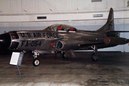 Lockheed F-94A Starfire. Developed from the T-33 Shooting Star, the two-place F-94 was the first American all-weather jet interceptor and the first U.S. production jet to have an afterburner. The large radar in the nose permitted the observer in the rear seat to locate an enemy aircraft at night or in poor weather. The pilot then flew the Starfire into proper position for an attack based upon the observer's radar indications.  TECHNICAL NOTES: Armament: Four .50-cal. machine guns Engine: Allison J33 of 6,000 lbs. thrust with afterburner  Maximum speed: 630 mph Range: 930 miles Ceiling: 42,750 ft. Span: 38 ft. 9 in. Length: 40 ft. 1 in. Height: 12 ft. 2 in. Weight: 15,330 lbs. Serial number: 49-2498