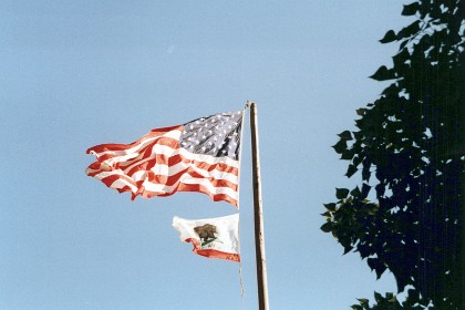 California's flag, the Bear Flag", flies under the US Flag. The precursor of the flag was first flown during the 1846 Bear Flag Revolt and was also known as the Bear Flag. It is believed that the bear on the flag is based on the last California grizzly kept in captivity. This bear was named “Monarch.”