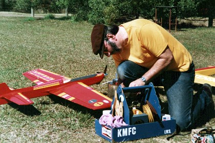 Ian puts Bonnie down for a moment and flies his plane in the competition.