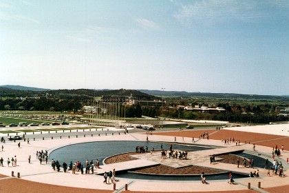 A multi-level pool sits outside the buildings entrance