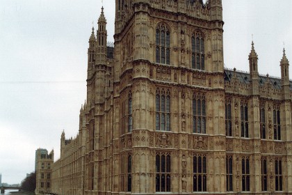 The Houses of Parliament at the Palace of Westminster on the River Thames.