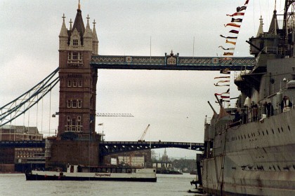 Tower Bridge comes into view. It is a Grade I listed combined bascule and suspension bridge built between 1886 and 1894.  It connects with the Tower of London on the north side.