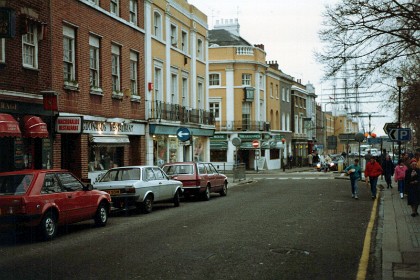 The village of Greenwich with the Cutty Sark moored on land in the distance.