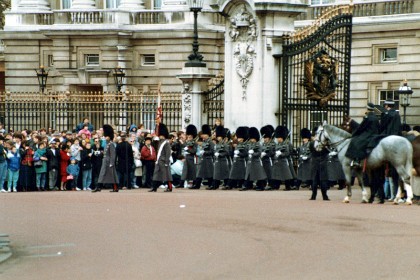 The Queen's Guard is normally provided by one of the five regiments of Foot Guards from the Household Division, instantly recognisable in their famous bearskin caps and red tunics.  It's possible these may be Grenadier Guards, number one in the hierarchy.