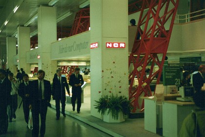 This is the NCR stand in Hanover's CeBIT. The CeBIT was the largest and most internationally representative computer expo until 2018. The trade fair was held each year on the Hanover fairground, the world's largest fairground, in Hanover, Germany. In its day, it was considered a barometer of current trends and a measure of the state of the art in information technology.