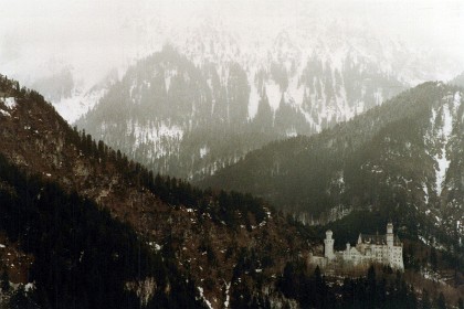 From this angle, Neuschswanstein looks alone in the mountains.