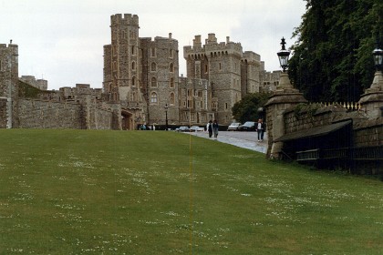 Windsor Castle, the Queen's country home. The castle is located about 22 miles west of London. The original castle was built in the 11th century after the Norman invasion of England by William the Conqueror. Since the time of Henry I (who reigned 1100–1135), it has been used by the reigning monarch and is the longest occupied palace in Europe.