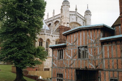 To the east is St George's Chapel.  It is a castle chapel built in the late medieval Perpendicular Gothic style. It is both a Royal Peculiar (a church under the direct jurisdiction of the monarch) and the Chapel of the Order of the Garter. St George's Chapel was founded in the 14th century by King Edward III and extensively enlarged in the late 15th century.