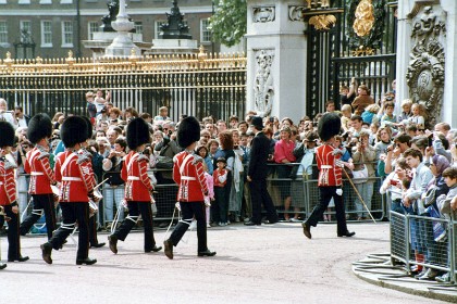 The Welsh Guards march in through the gates of Buckingham Palace