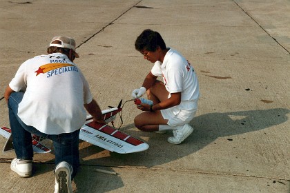 Tom Lay assists Kaz get ready for an official flight.