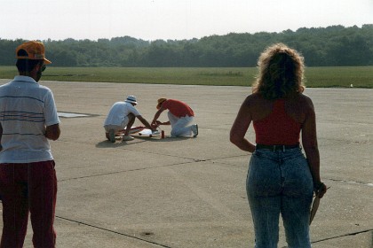 Paul Walker starts his engine as Jenni looks on.