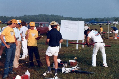 Meanwhile, Bob wipes his plane down after his warmup flight. Ted looks on.