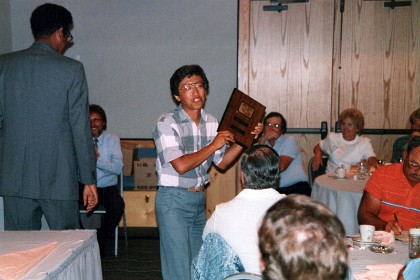 Kaz receives his fifth place trophy.