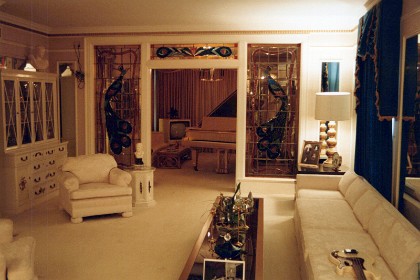 In the living room.  The piano is gold-plated completed after Priscilla gave it to him as a white piano.