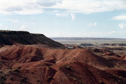 The Painted Desert is a  desert of badlands in the Four Corners area, running from near the east end of Grand Canyon National Park and southeast into Petrified Forest National Park.