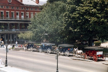 Tourist rides near the waterfront in Decatur Street. St Peter Street is on the corner.