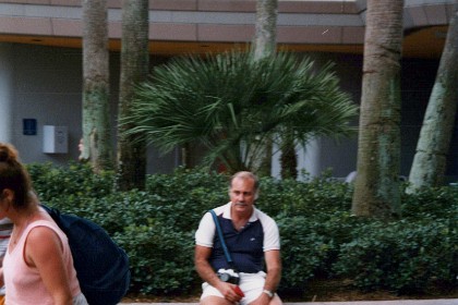 Brian at the end of a long hard (and for him boring)  day. His feet are too sore to walk on.  And Epcot requires a LOT of walking.