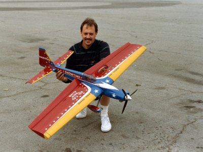 I pose with Bob's newest plane. Sue Whitely says, "It looks like Walt Disney threw up all over it."