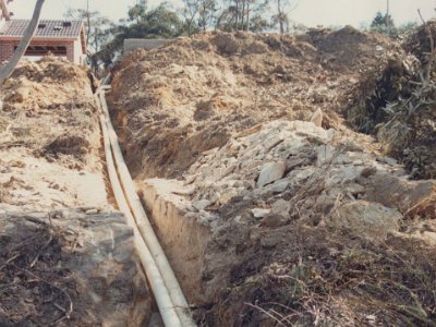 Stormwater and sewerage pipes down the back of the block.