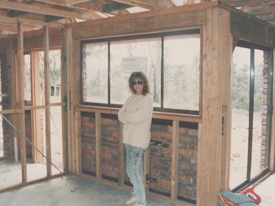 Frame erected    8-10 August, 1989.   &nbsp;  Jenni standing in the future kitchen.